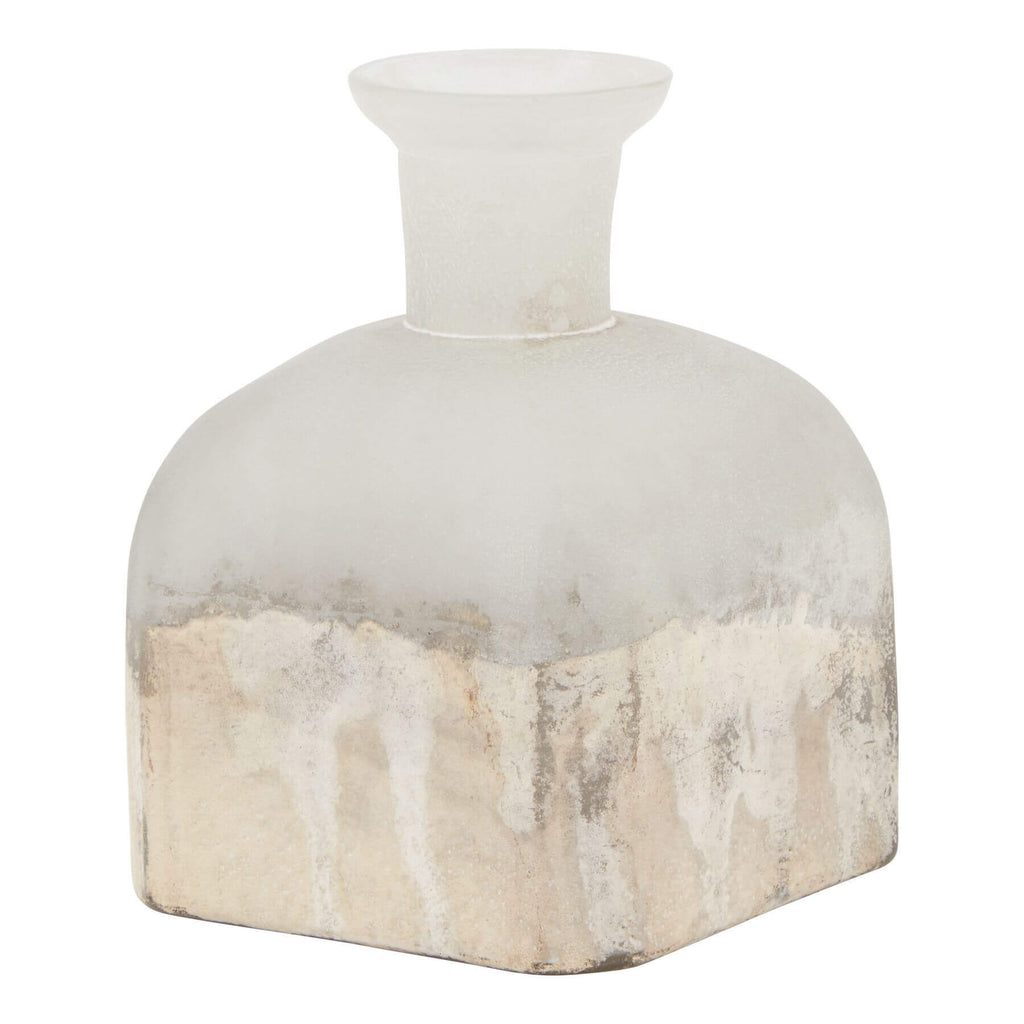 Burnished brass candle holder vase with glass base, warm grey finish, and vintage-inspired metallic accents for home decor. by Sostter at brixbailey.com