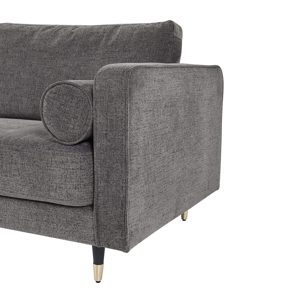 Grey fabric armchair with plush upholstery and curved arms, blending modern elegance with classic comfort for any living space. by sostter at brixbailey.com