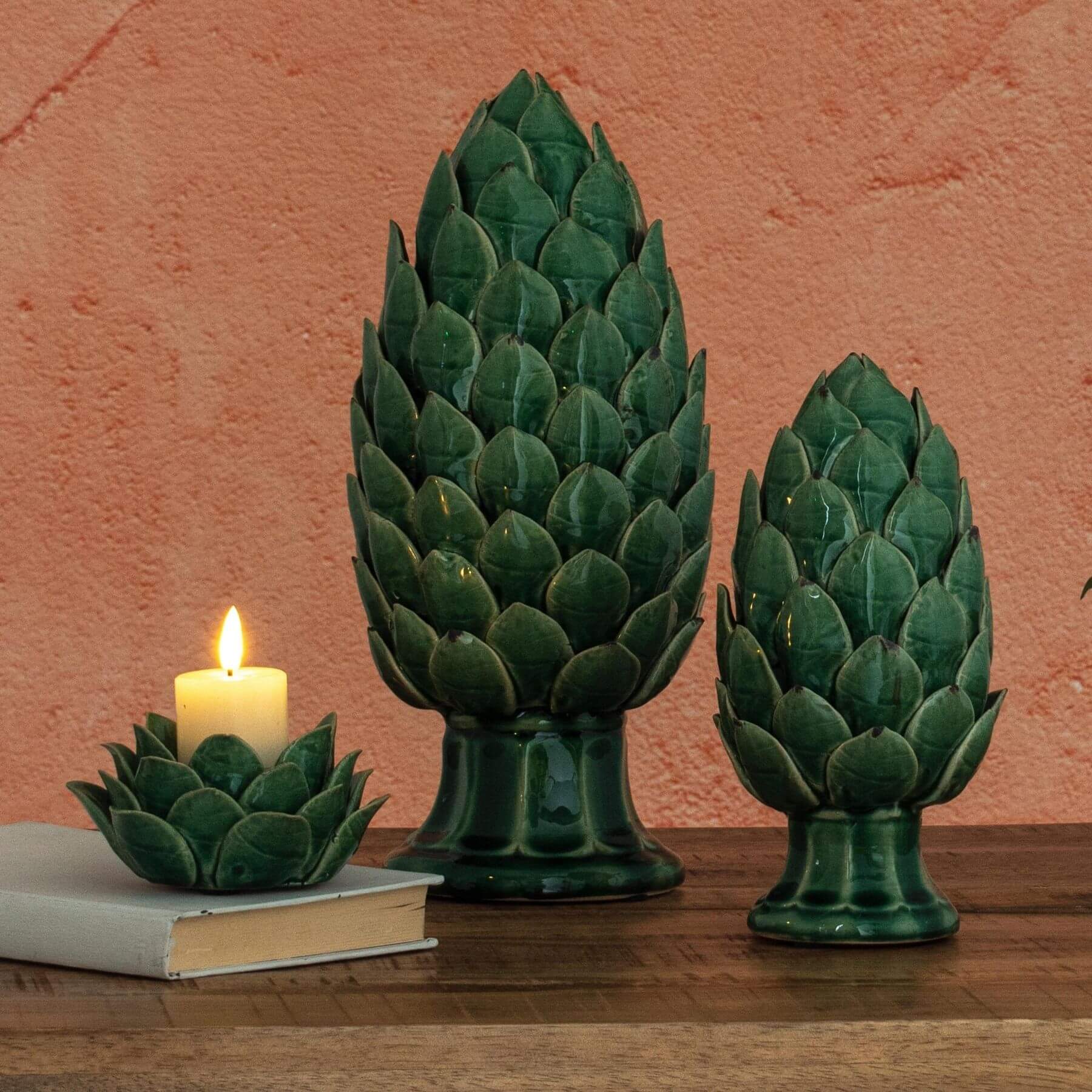 Handcrafted ceramic tea light holder with artichoke cutouts, botanical green glaze, casting enchanting shadow patterns. by RoomLondon at brixbailey.com