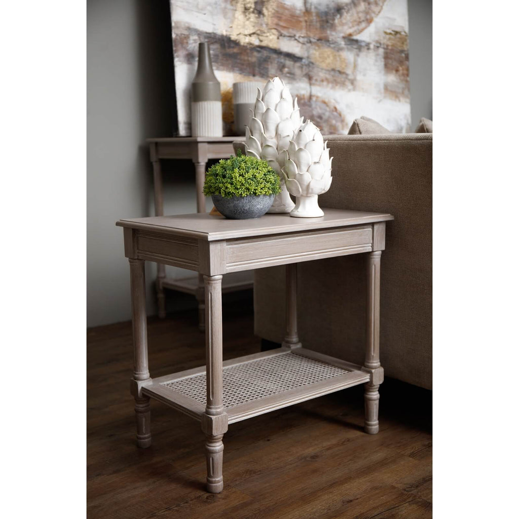 Handwoven rattan side table with tapered legs in soft grey, 60cm height, modern organic texture for coastal or minimalist decor by RoomLondon at brixbailey.com