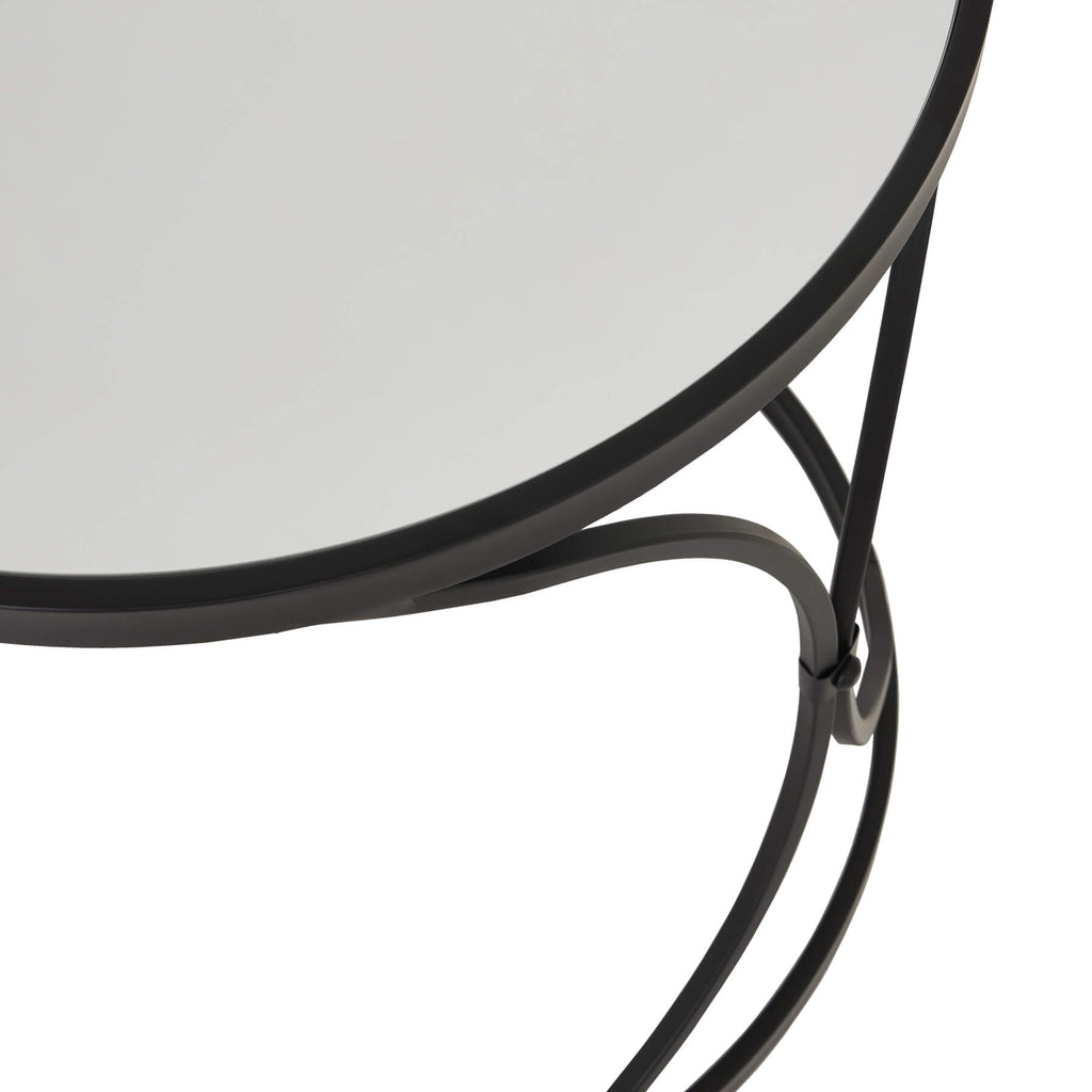 Black metal nesting side tables with mirrored glass surfaces, modern accent furniture for stylish home decor. by RoomLondon at brixbailey.com