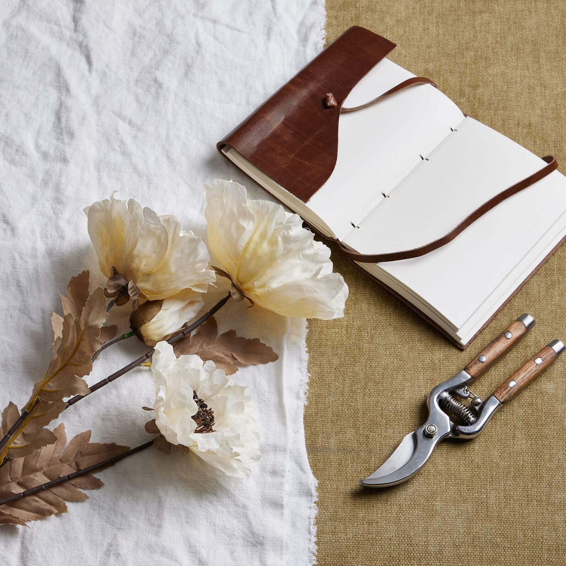 Artificial poppy stem with off-white petals and coffee accents, 105 cm tall, for year-round floral decor by Sostter at brixbailey.com