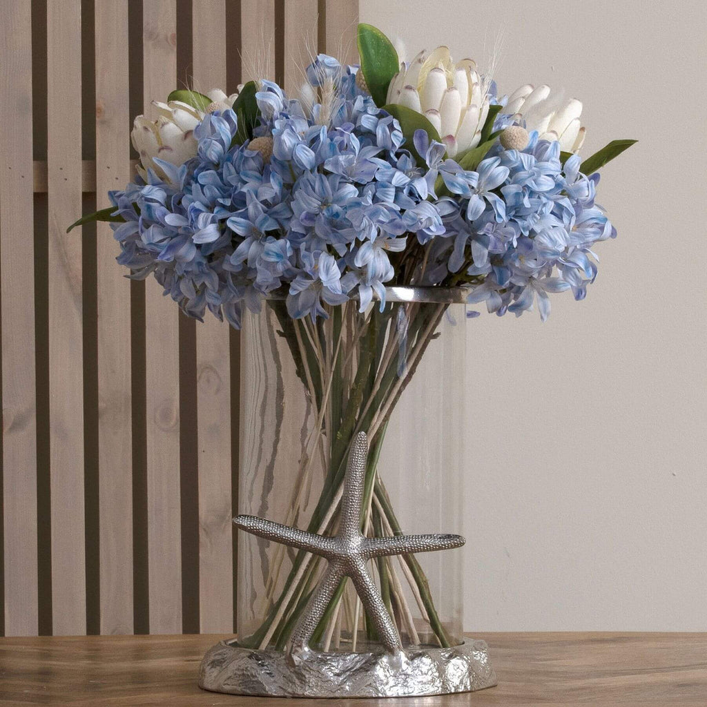 Lifelike artificial agapanthus bloom in soft blue, detailed plastic petals, perfect for coastal home decor arrangements by Sostter at brixbailey.com