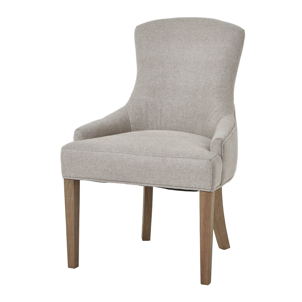 Oatmeal twill dining chair with tufted detailing, curved back, and solid oak legs for elegant comfort. by RoomLondon at brixbailey.com