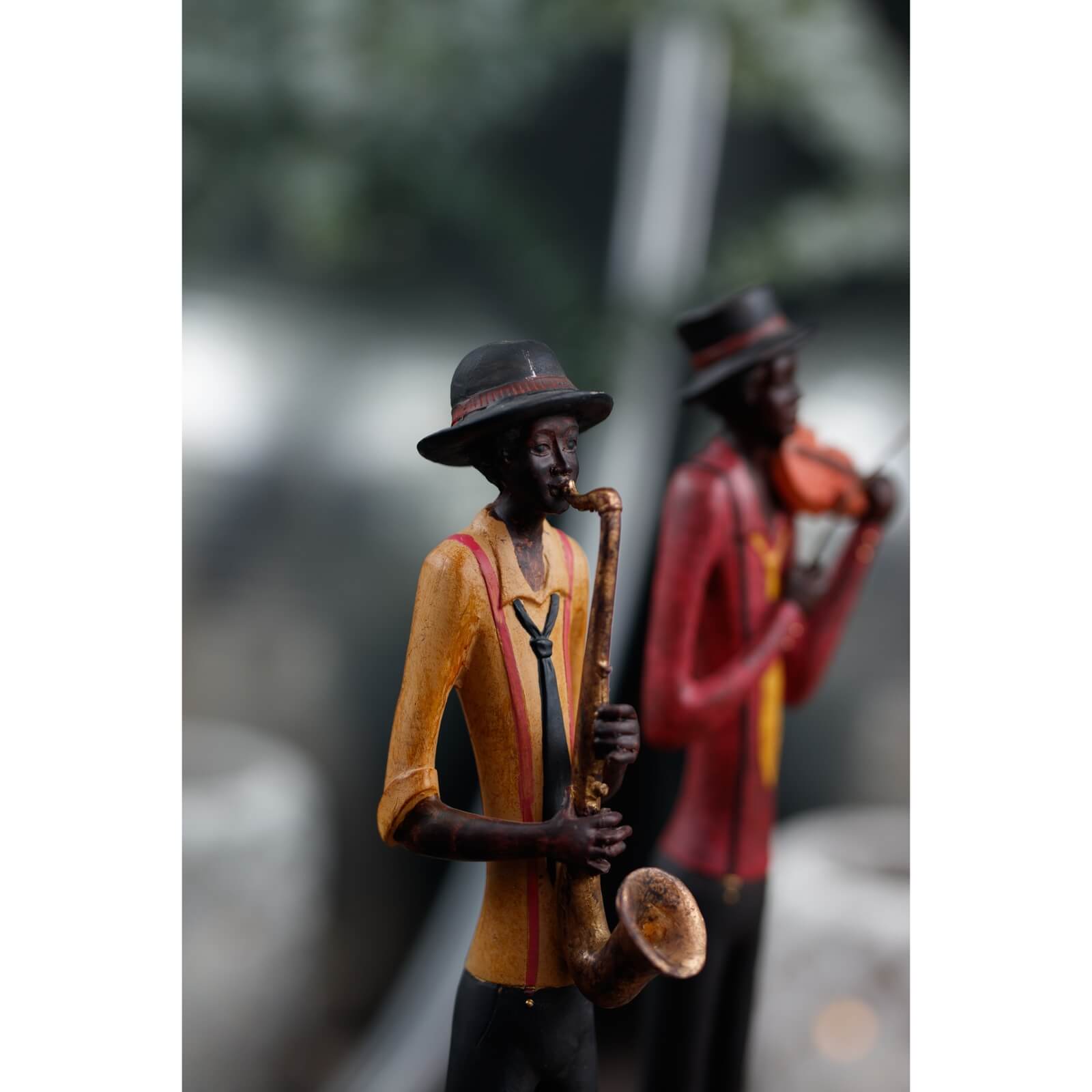 Handcrafted wooden jazz violinist sculpture in red jacket, dynamic mid-performance pose, 60cm resin art deco decor by sostter at brixbailey.com