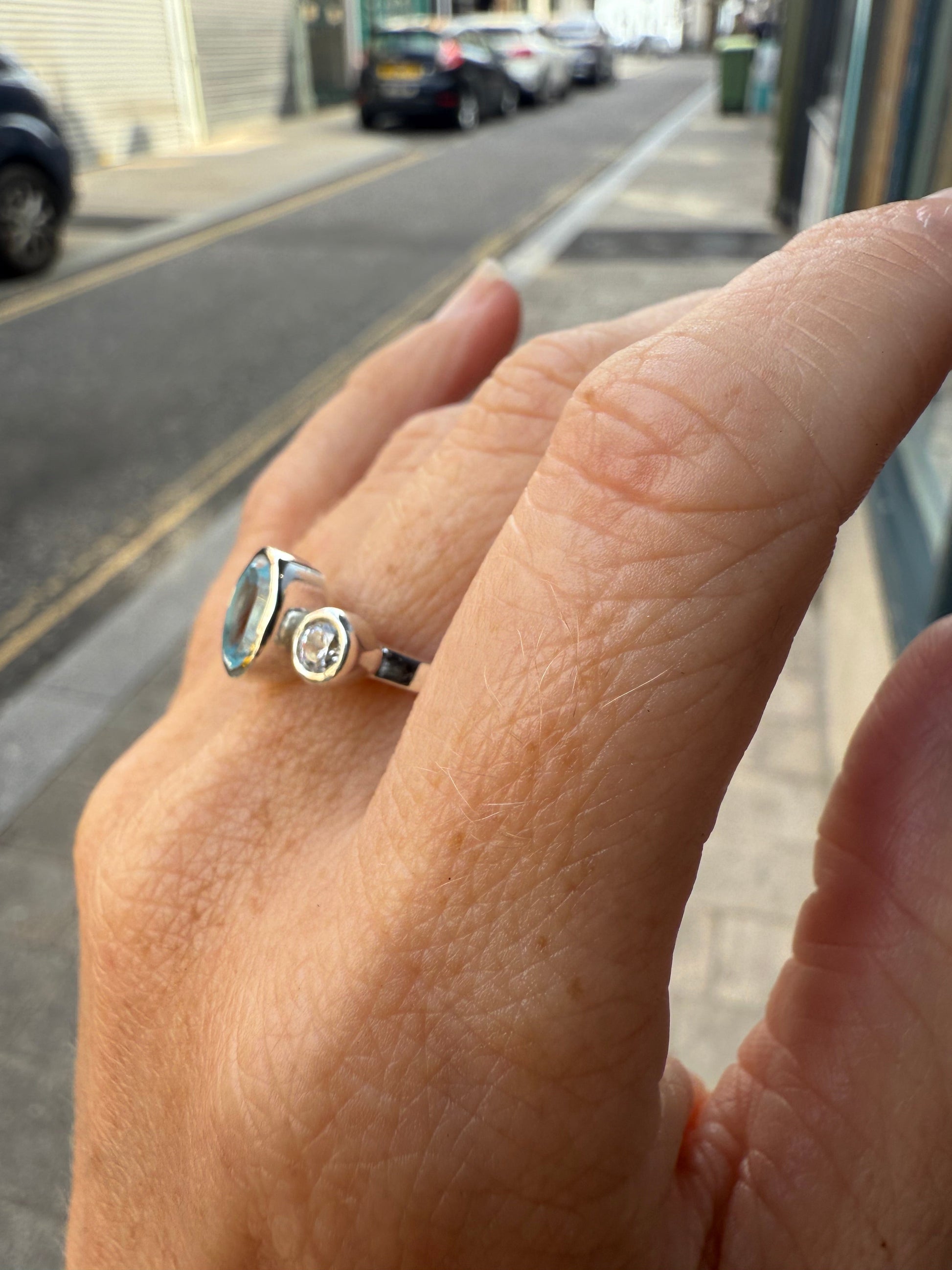 Oval Blue Topaz Trilogy Empire Ring