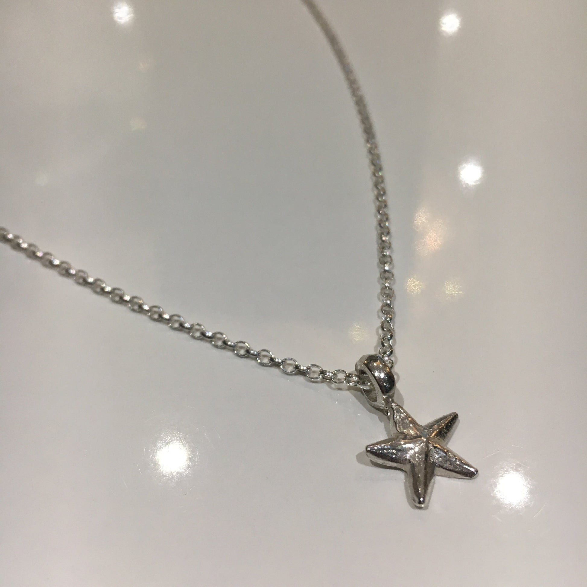 Lucky Charm Starfish Necklace in Sterling Silver