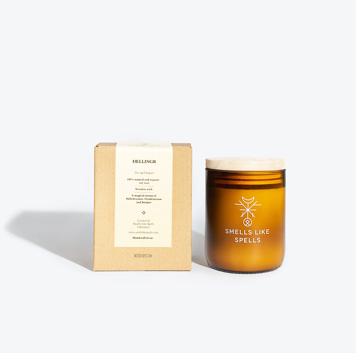 playful dellingr candle with glowing wooden wick and amber jar on a bright morning