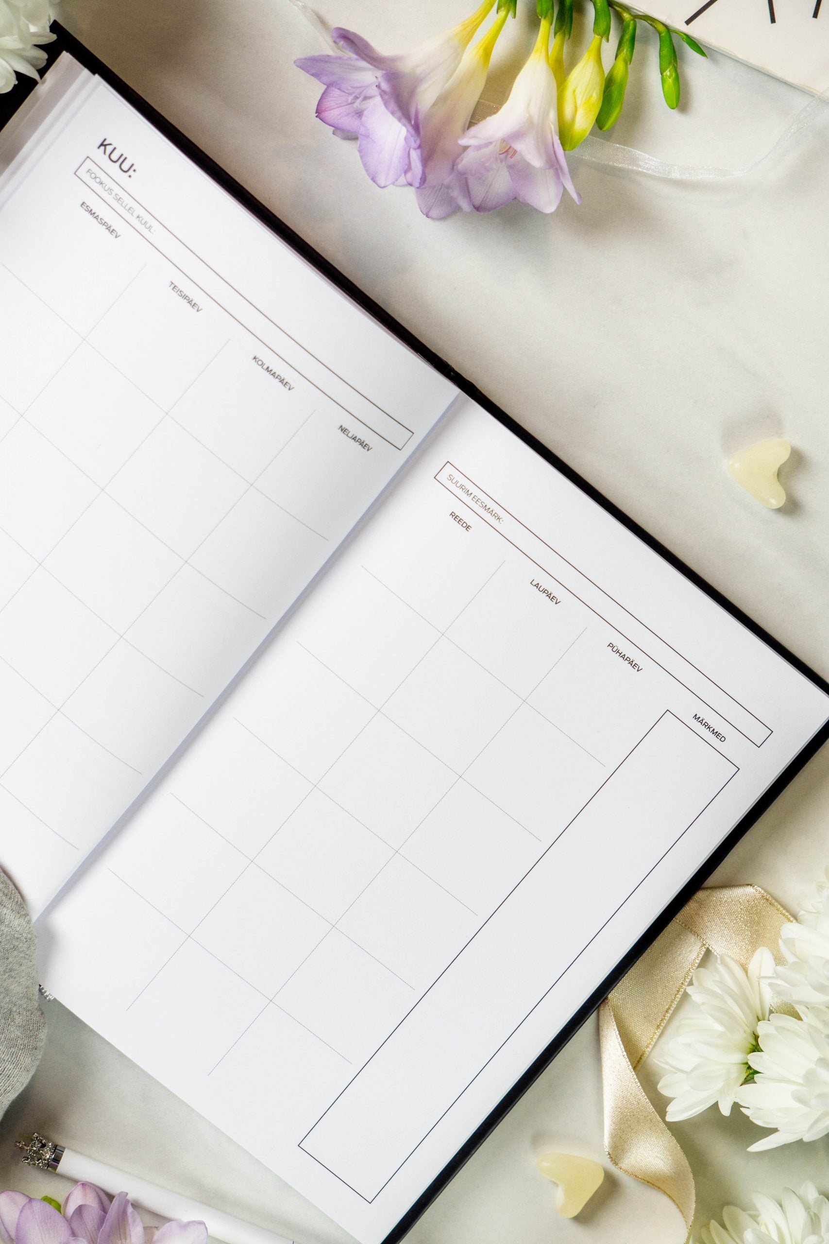 productivity planner open on a desk with morning light highlighting its daily task pages