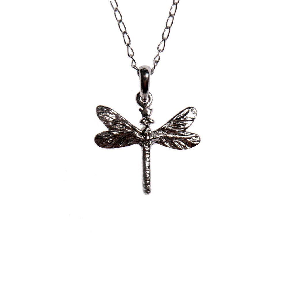 confident close-up of a dark dragonfly pendant on a silver chain, gemstones glinting with bold strength