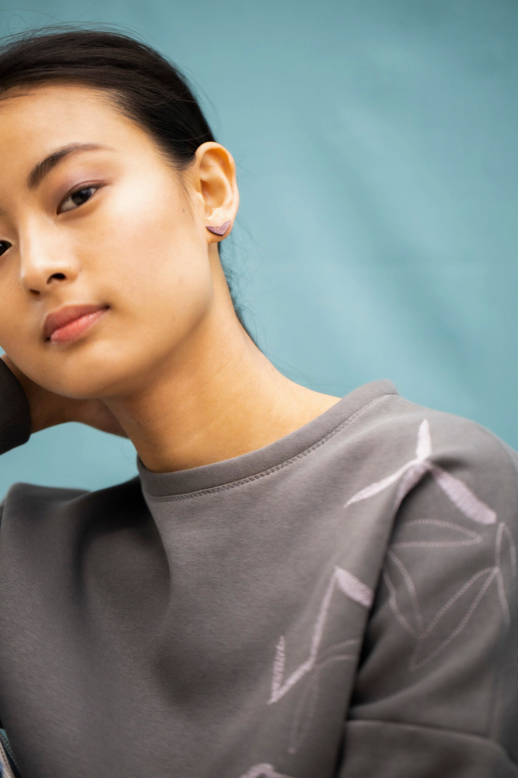 elegant vola purple earrings in soft morning light, showcasing polished eco-friendly stainless steel