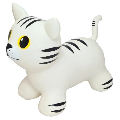 a playful white cat hopper toy bouncing joyfully on a sunny lawn