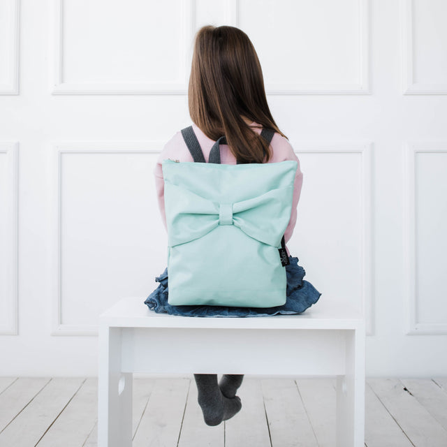 Mint Bow Backpack for Kids – Waterproof & Playful Design by Muni at www.brixbailey.com