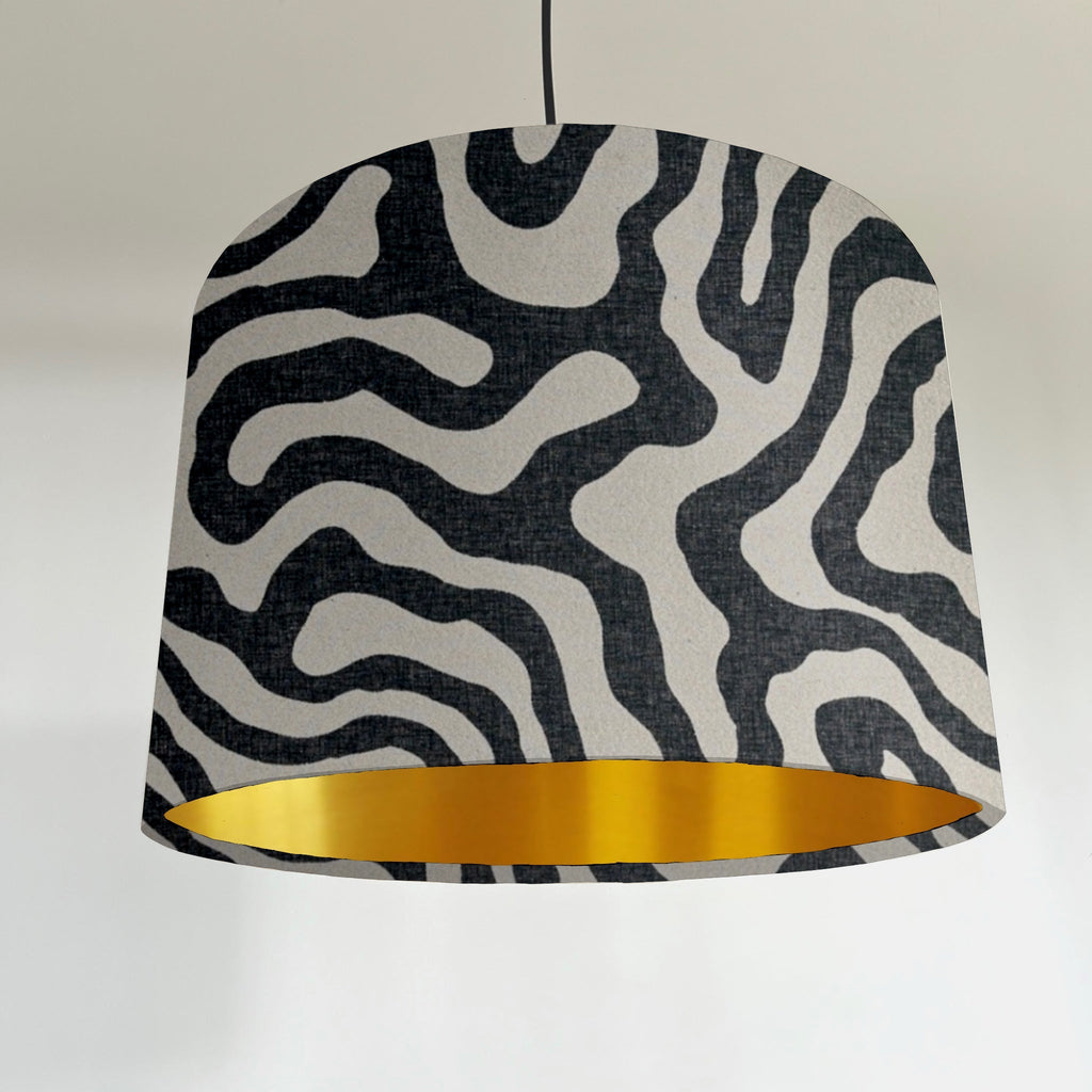 Black wiggle drum lampshade/ ceiling shade with a metallic brushed gold lining