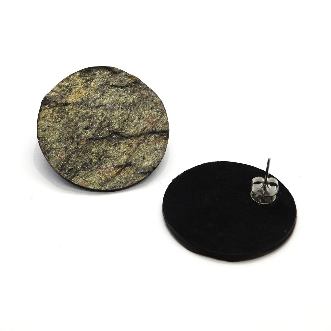 bold minimalist slate and marble orbit earrings on a dark background