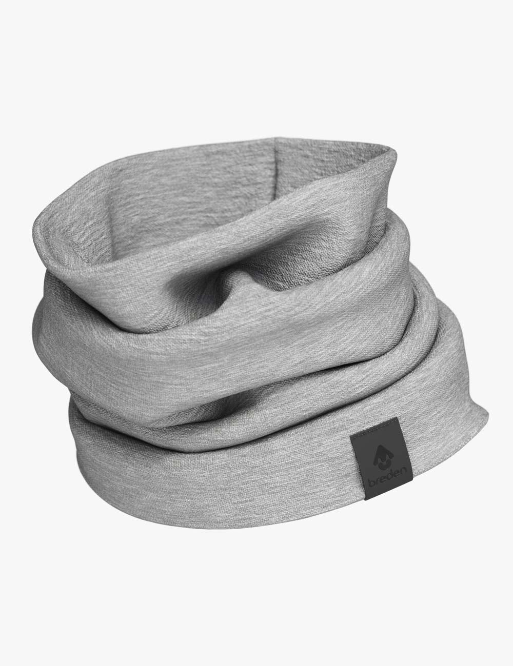 elegant merino wool tube scarf draped over a rustic wooden bench in soft morning light