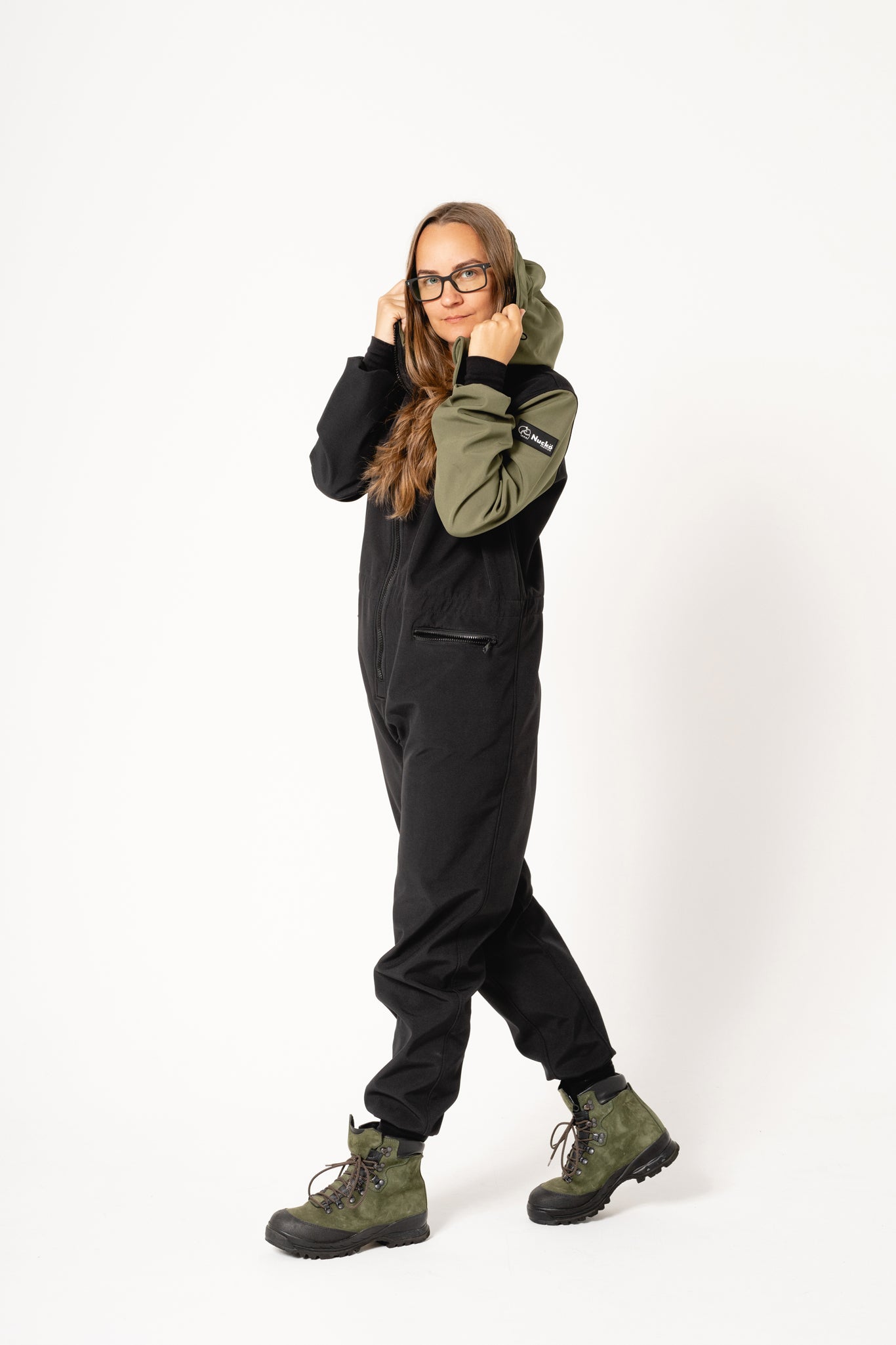 confident woman in carola softshell overall ready for a mountain hike in estonian mist