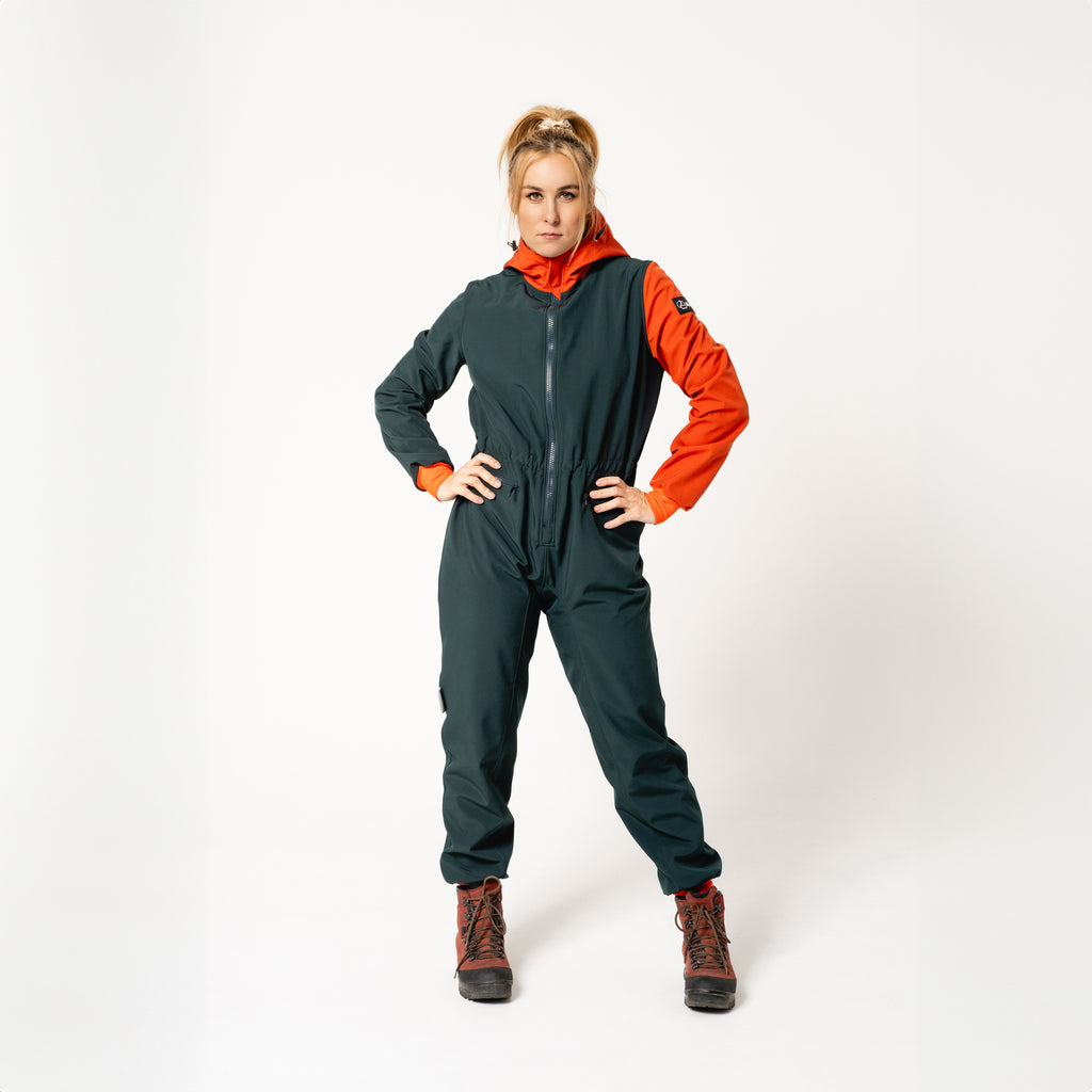 bold woman in a stylish waterproof softshell overall confidently facing the elements