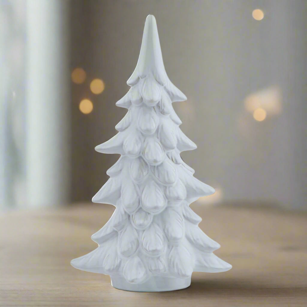 Handcrafted frosted fir tree sculpture with snow-dusted branches, 40cm white Nordic-inspired winter decor by Sostter at brixbailey.com
