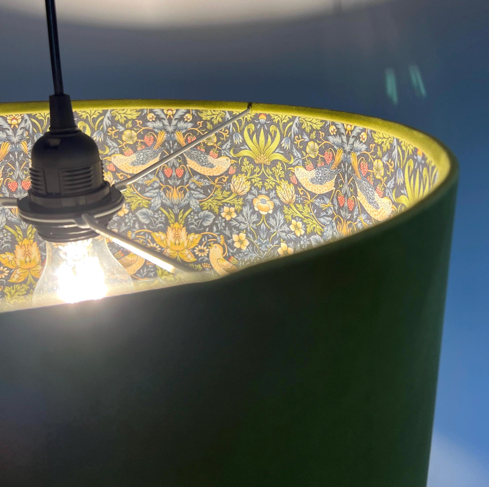 Olive green velvet drum lampshade, double sided lampshade, with navy strawberry thief cotton interior