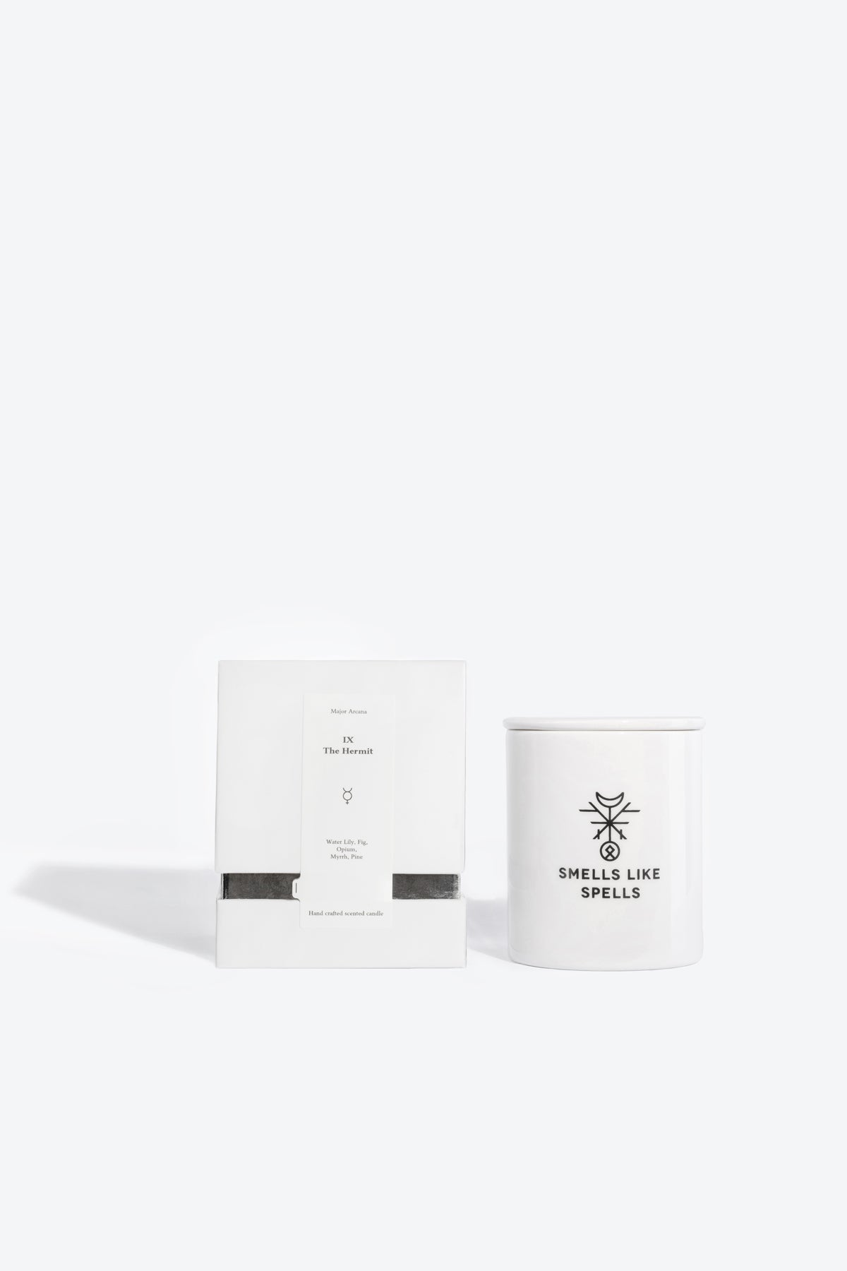 bold hermit scented candle in handmade porcelain, glowing with a mystical aura of wisdom and introspection