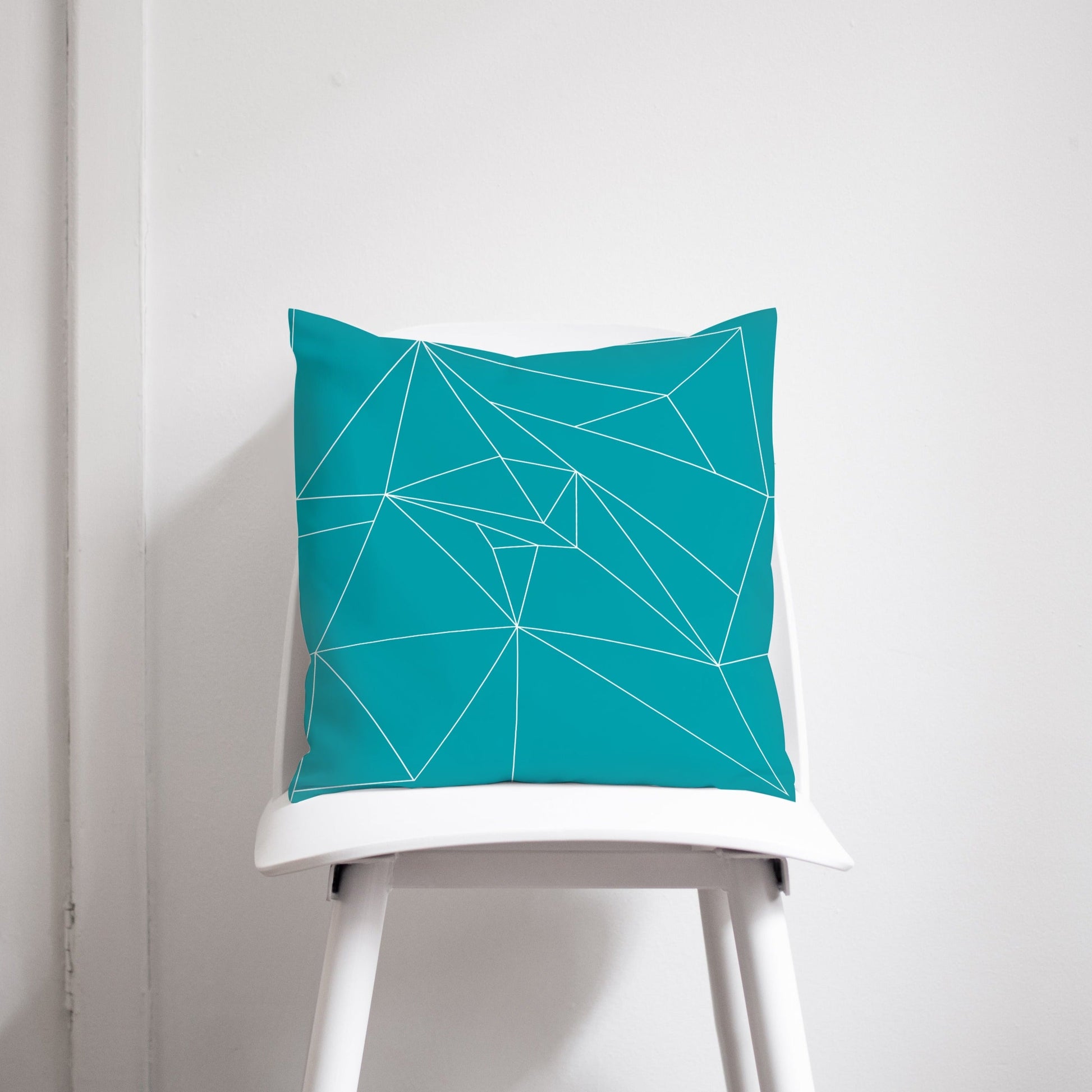 Turquoise Throw Pillow with White Geometric Design