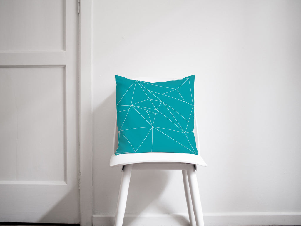 Turquoise Throw Pillow with White Geometric Design