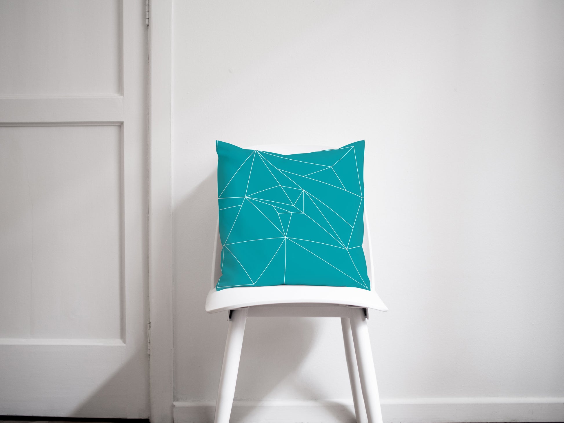 Turquoise Throw Pillow with White Geometric Design