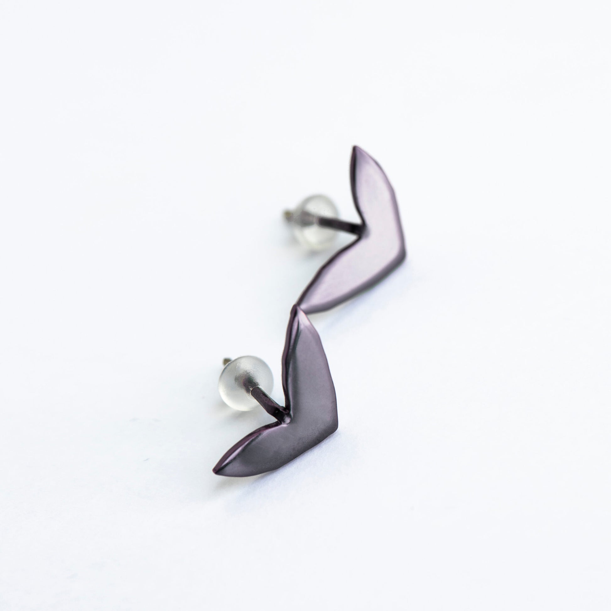 soft close-up of vola purple eco earrings in a gift box with velvet lining