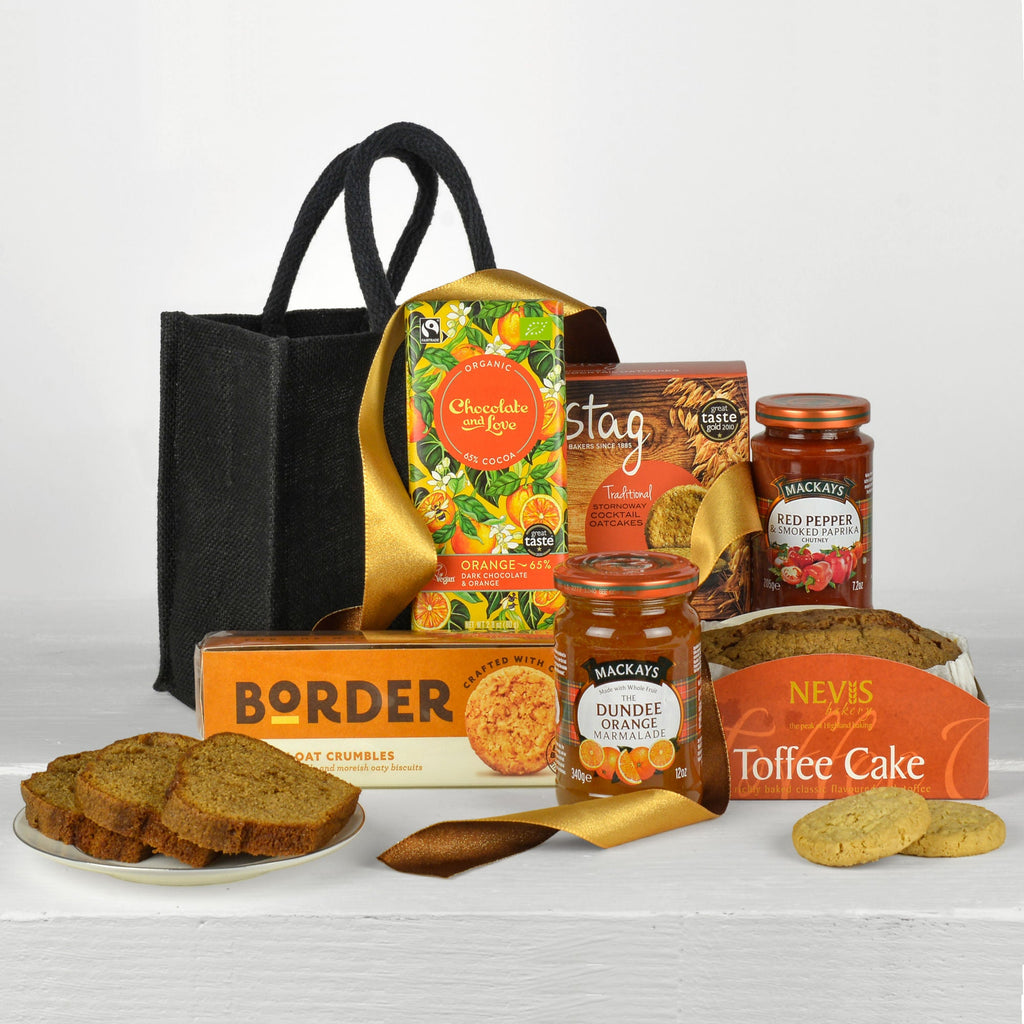 Assorted food products including jars, a bag, and bread on a white background