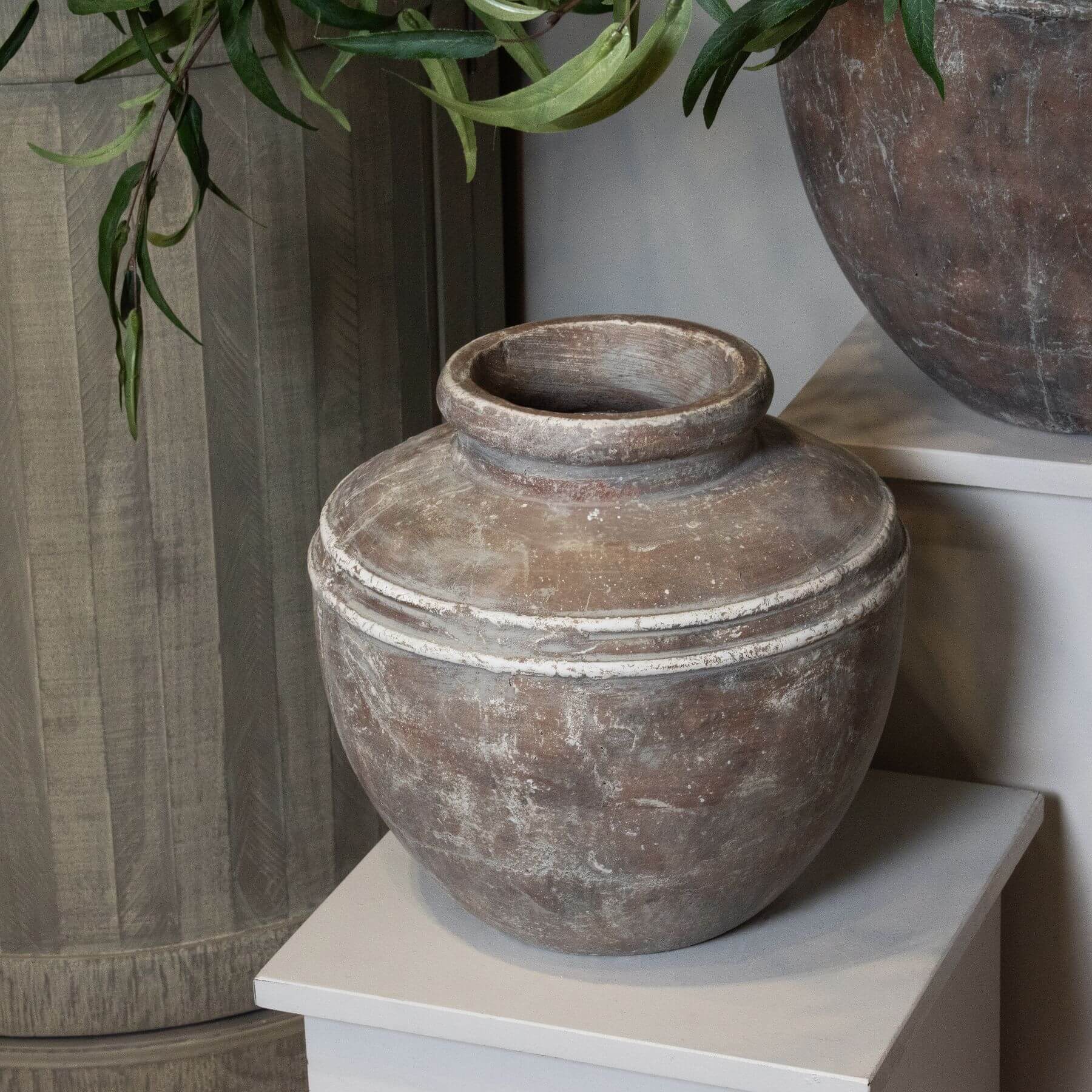 Distressed brown ceramic Siena water pot with urn shape, organic textures, and handcrafted glaze for floral displays. by sostter at brixbailey.com