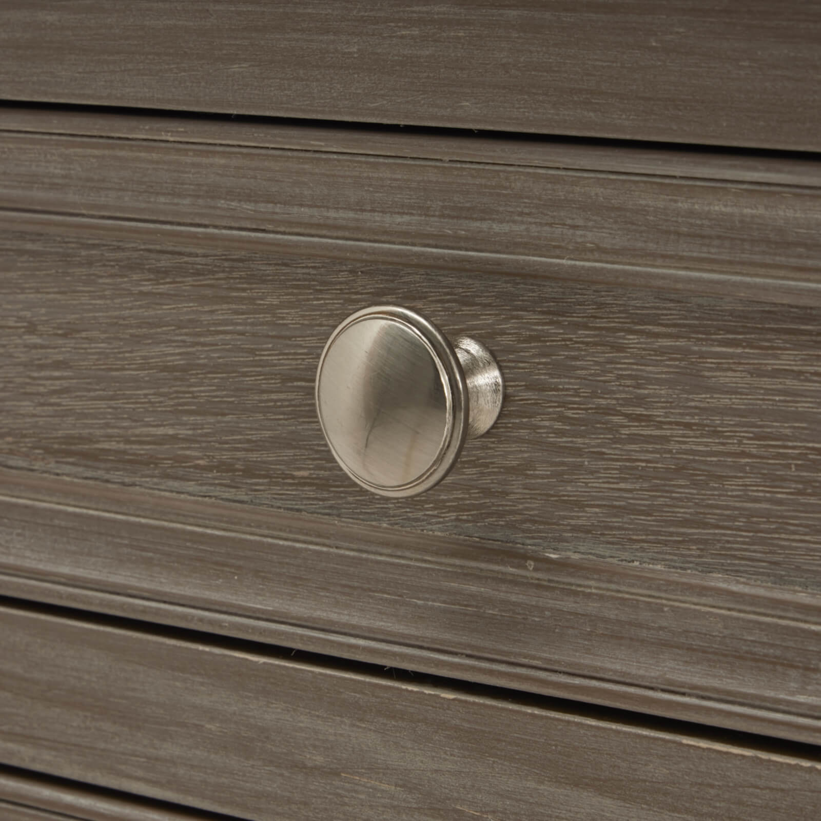 Distressed grey wooden bedside table with three drawers, solid wood construction, warm rustic finish. by sostter at brixbailey.com