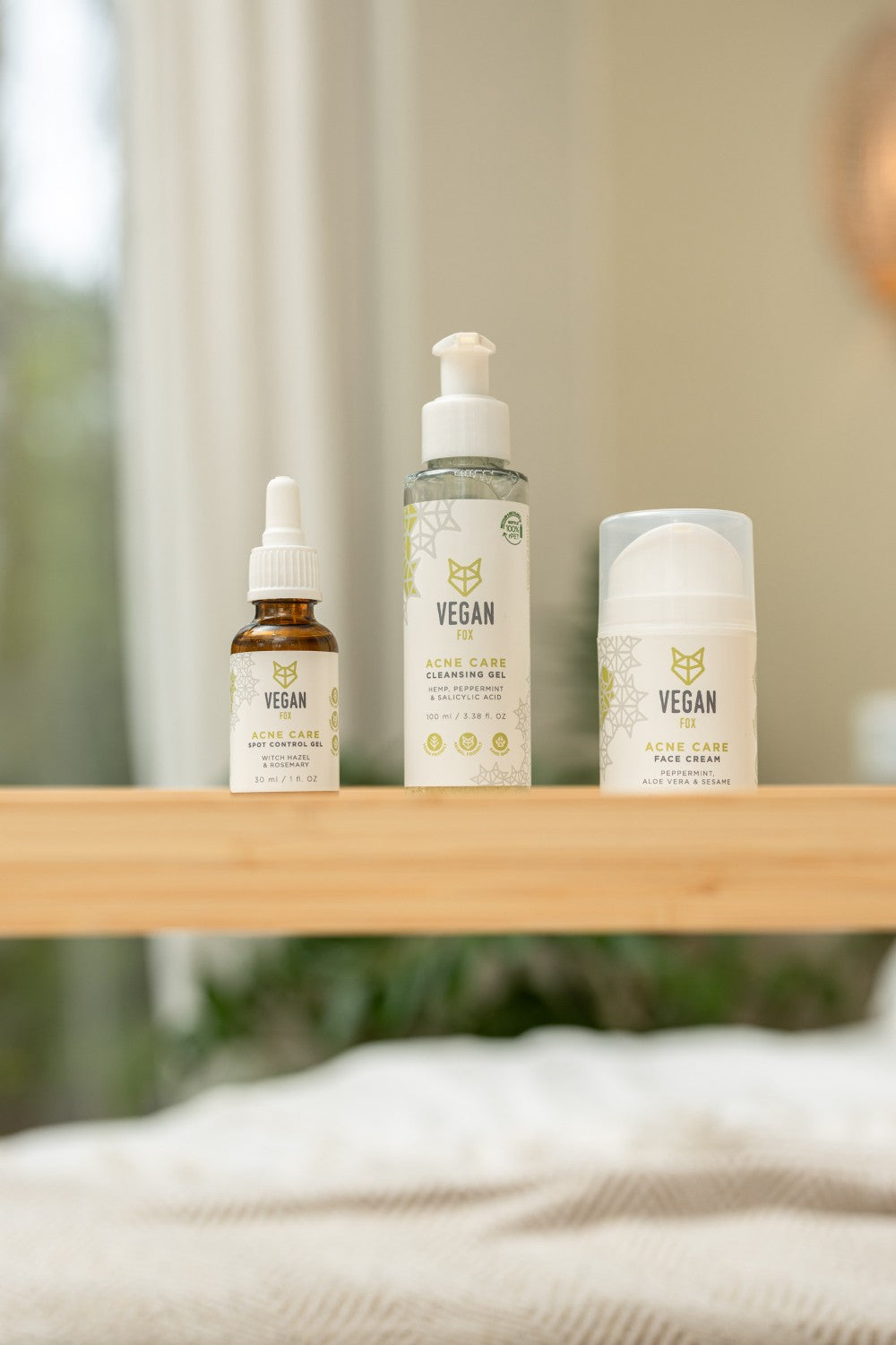 elegant acne care face set with cream, gel, and cleanser arranged on marble with soft lighting