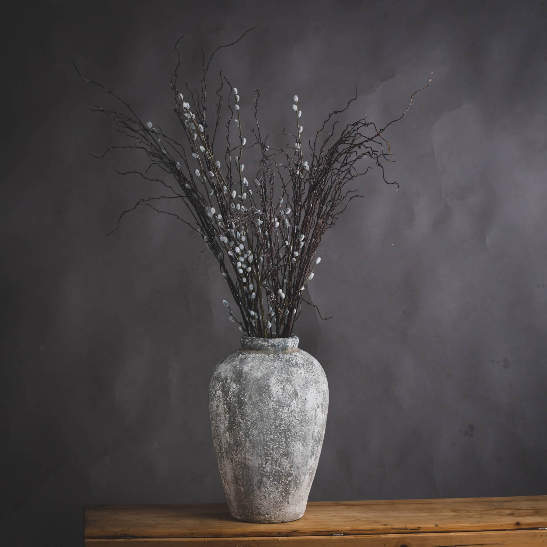 close-up of the textured stone finish on a tall ceramic vase, highlighting its practical 45cm height and rustic artisan craft