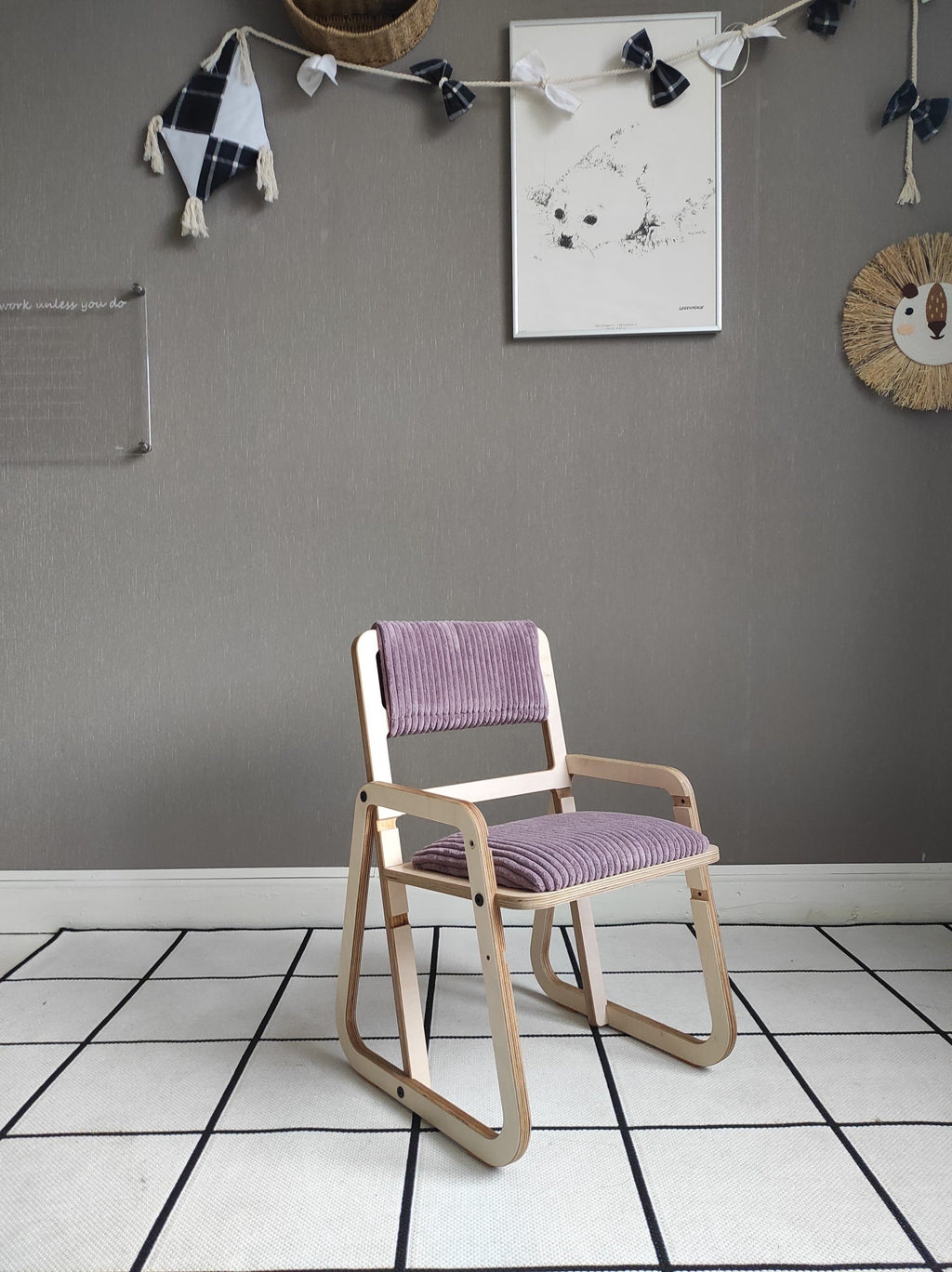 a playful cannon pink kids chair with warm wood grain visible in soft morning light