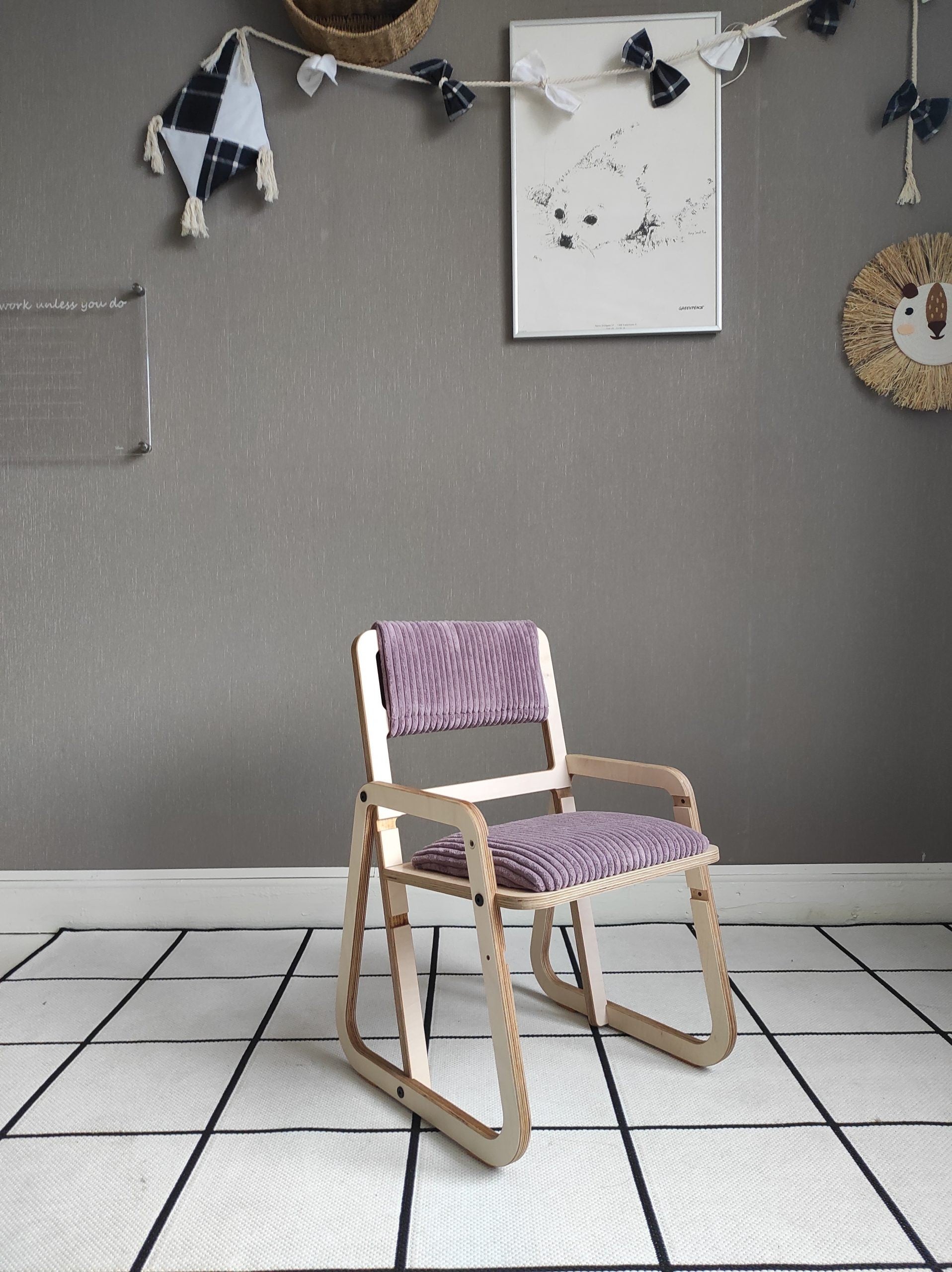 a playful cannon pink kids chair with warm wood grain visible in soft morning light