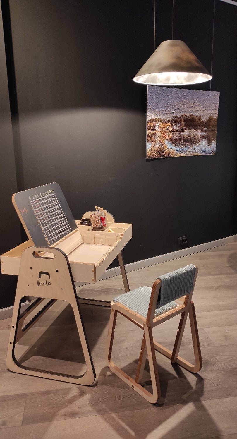 close-up of the julle chair's mint green birch plywood armrest and plush padding