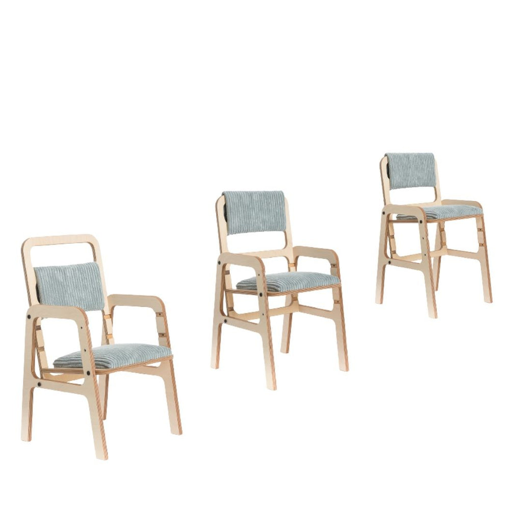 bold mint green ergonomic kids chair with natural birch wood frame in a bright studio setting