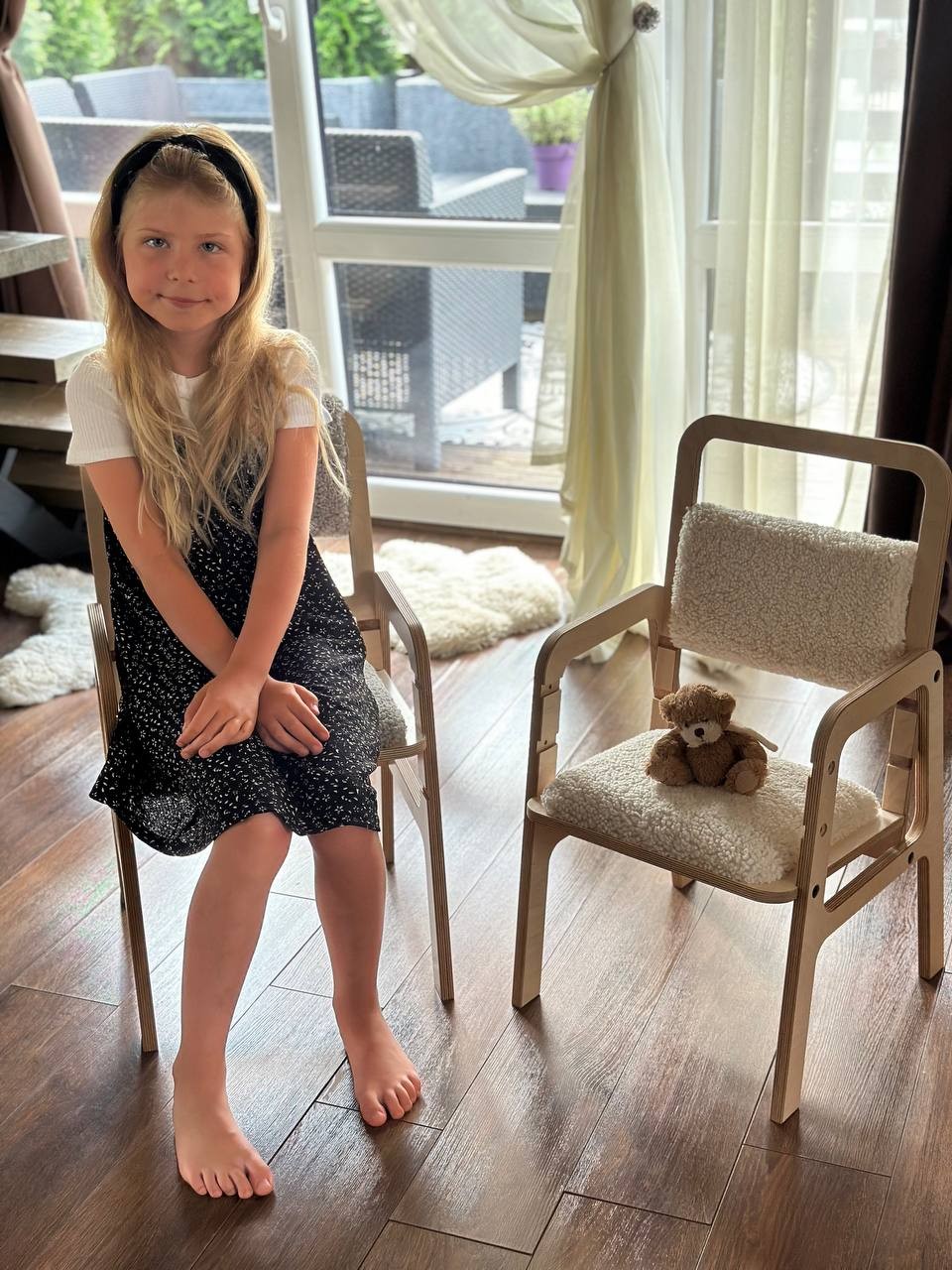 luula vanilla lamb kids chair in soft morning light with cozy fabric texture