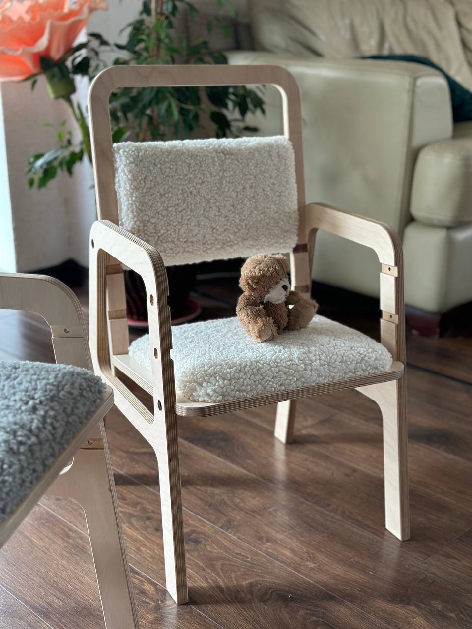 a playful vanilla lamb kids chair with soft recycled fabric in a sunny playroom