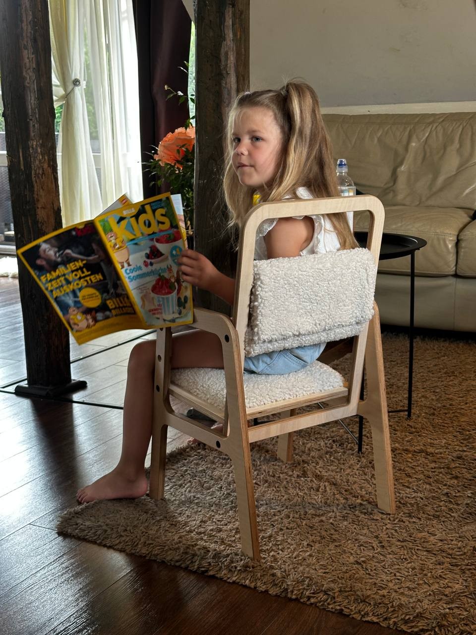 bold vanilla lamb luula chair - adjustable ergonomic kids furniture in natural light