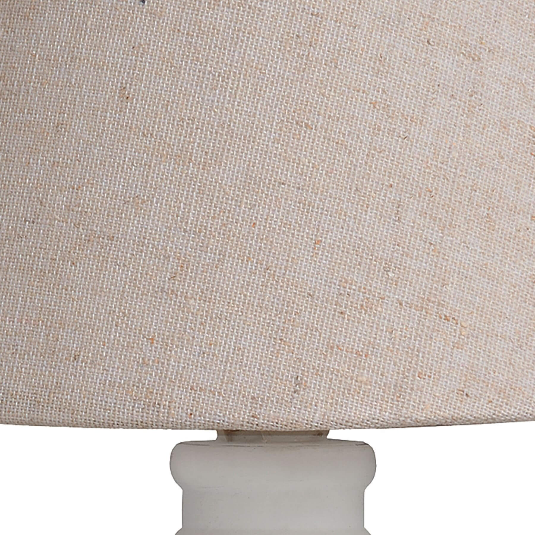 Handcrafted beige Cyrene table lamp with oatmeal shade and white wooden base for warm, elegant lighting. by Sostter at brixbailey.com