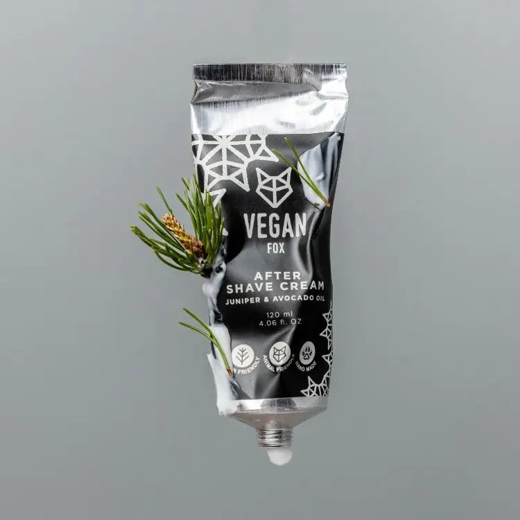 soft-lit close-up of vegan after shave cream with avocado oil, juniper berry, and forest scent in eco-friendly tube