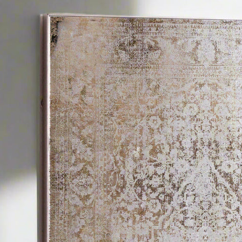 Decorative rug with intricate pattern on a plain background