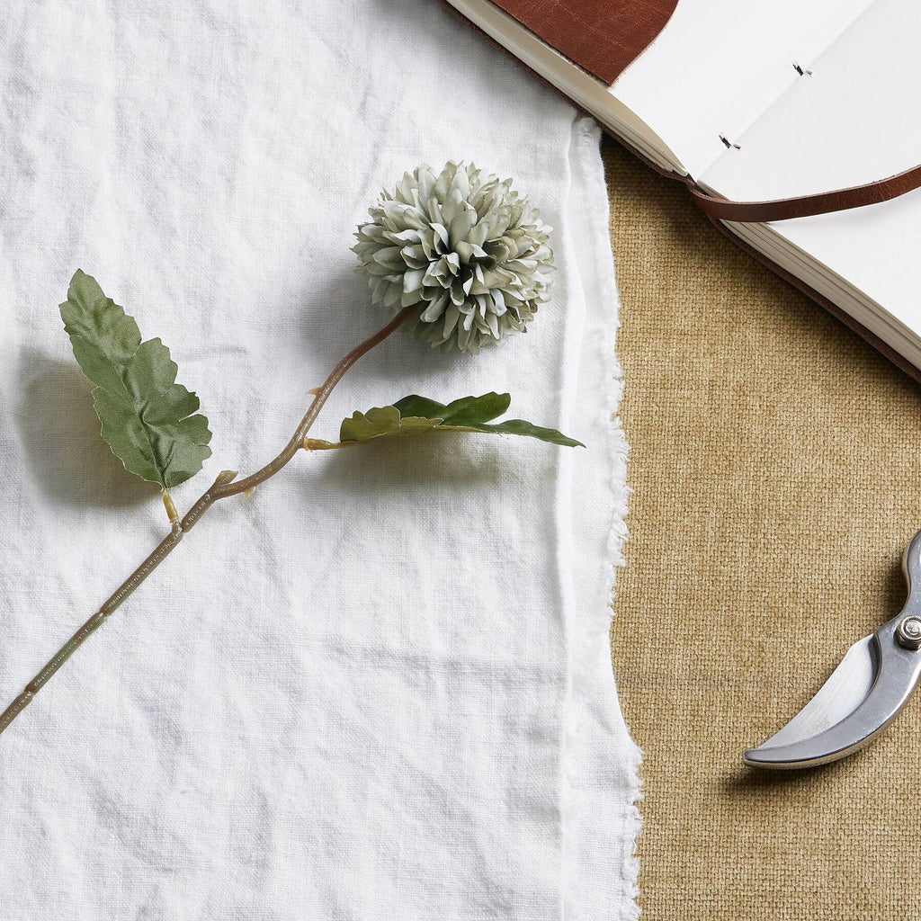 Pale green-blue artificial chrysanthemum stem with realistic petals and leaf, perfect for home decor arrangements. by sostter at brixbailey.com