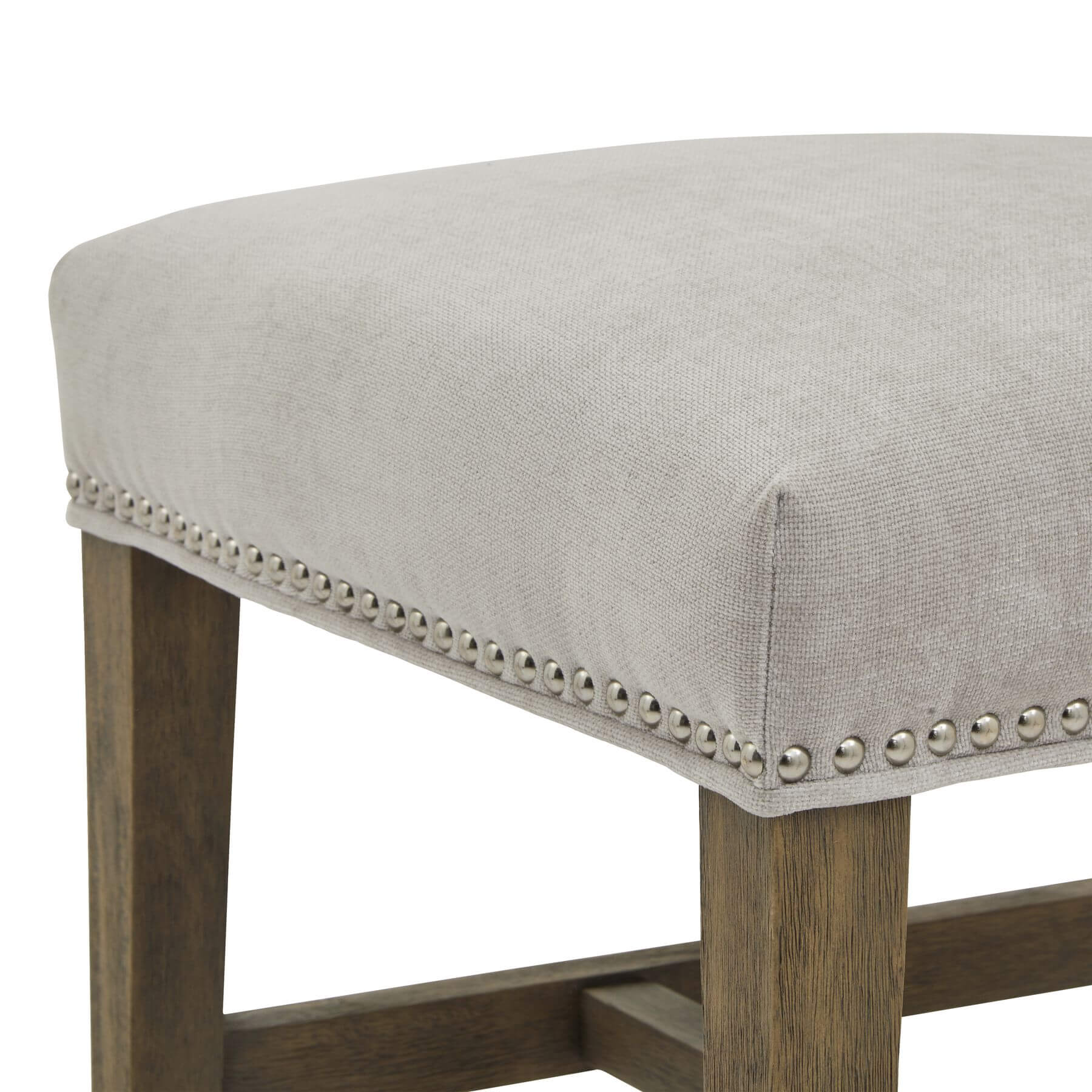 Cobham grey dining chair with padded seat, antique brass studs, and weathered oak frame in French provincial style by Sostter at brixbailey.com