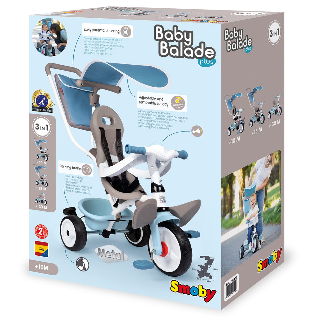 blue baby balade plus tricycle with sun visor and storage bag in a park