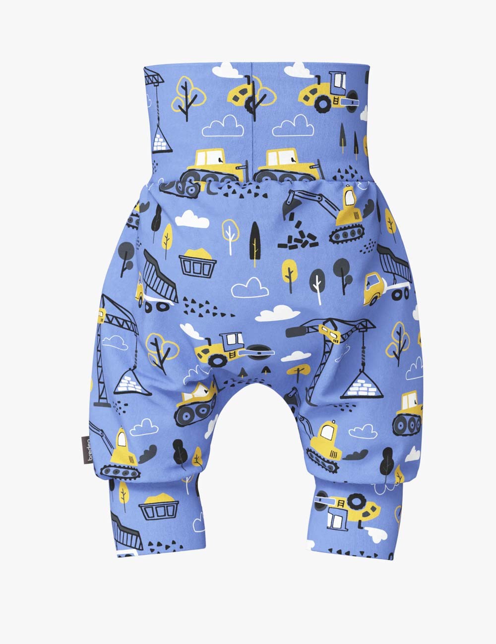 playful baby boy in gunnar construction shorts laughing on a sunny day