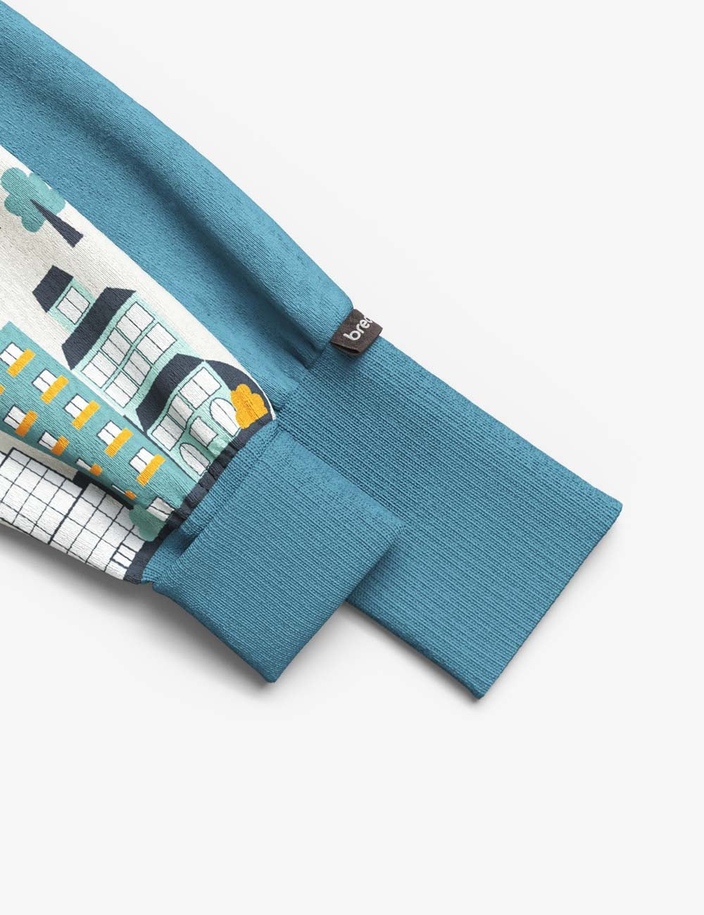 functional baby sleepsuit with two-way zipper for easy diaper changes, shown in a soft morning light