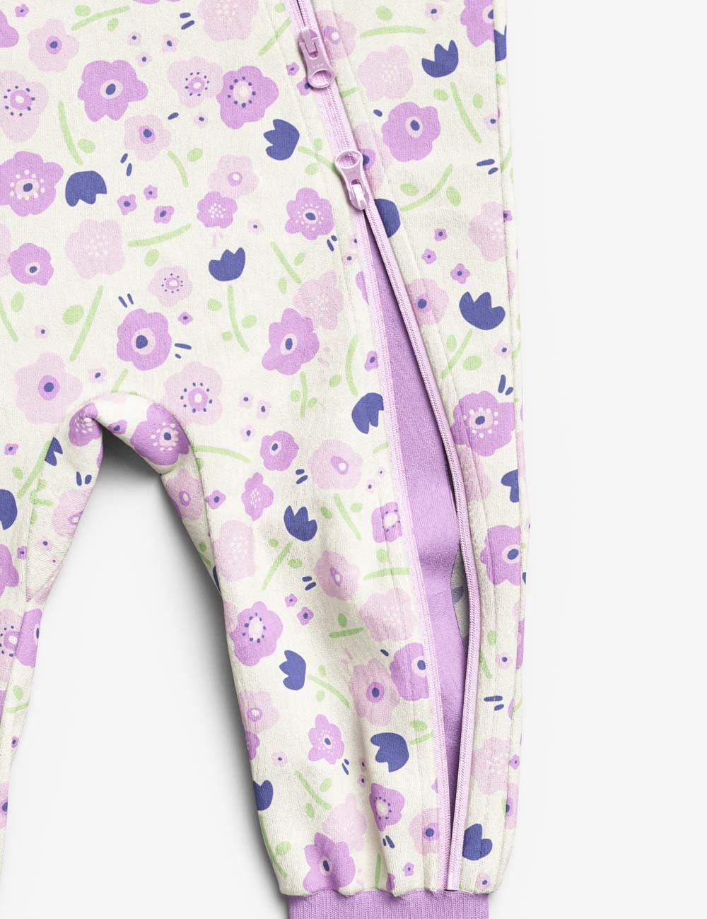 elegant baby floral sleepsuit with a close-up on the delicate summer flower pattern and stretchy ribbed cuffs